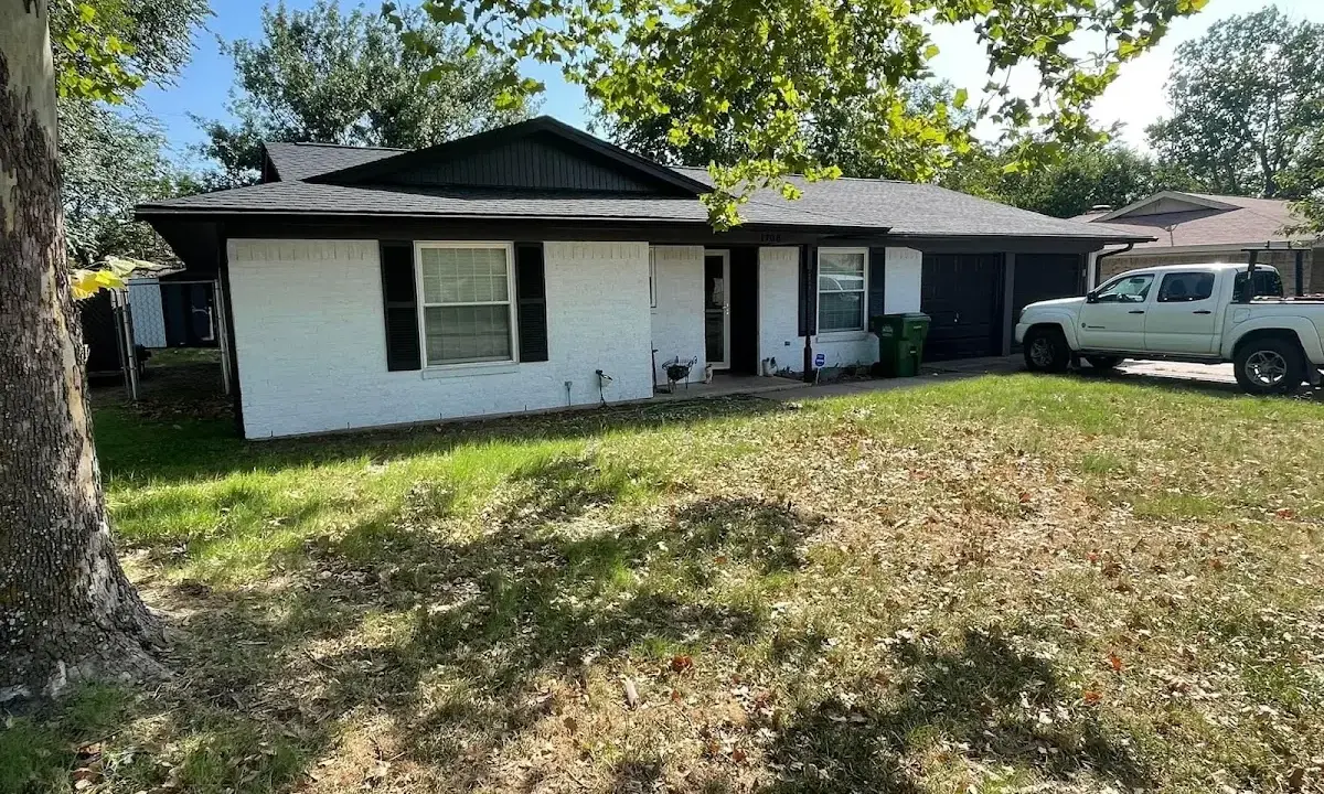 Professional roofing crew working on a residential roof in Riverdale